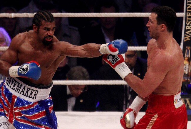 HAMBURG, GERMANY - JULY 02:  David Haye of England jabs Wladimir Klitschko of the Ukraine during their heavy weight unification match at the Imtech Arena on July 2, 2011 in Hamburg, Germany.  (Photo by Scott Heavey/Getty Images)