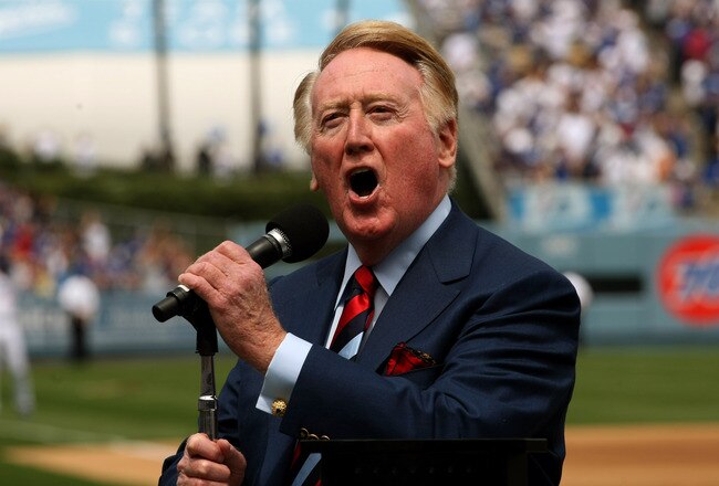 LOS ANGELES - APRIL 13:  Dodgers broadcaster Vin Scully gives the call of 'It's time for Dodger baseball!' during pregame ceremonies for the Los Angeles Dodgers home opener against the San Francisco Giants on April 13, 2009 at Dodger Stadiium in Los Angeles, California. (Photo by Stephen Dunn/Getty Images)