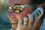 PHOENIX - MARCH 03:  General manager Billy Beane of the Oakland Athletics talks on the phone during the MLB Spring Training game against the Milwaukee Brewers at Phoenix Municipal Stadium on March 3, 2006 in Phoenix, Arizona.  The Brewers defeated the A's 5-1.   (Photo by Christian Petersen/Getty Images)