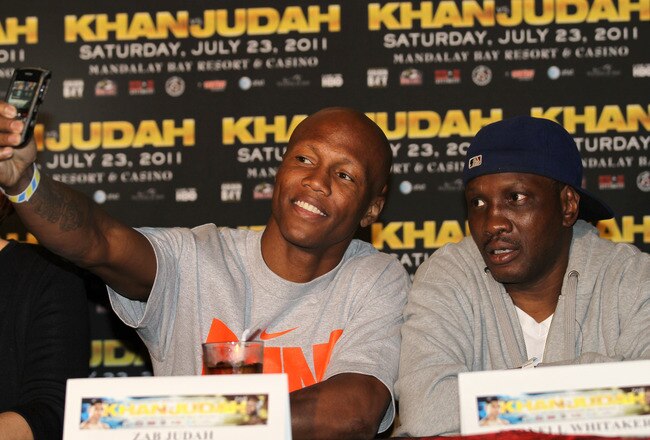 LOS ANGELES, CA - JUNE 08:  Zab Judahtakes a cell phone picture of himself with trainer Pernell Whitaker as they appear at a press conference with Amir Khan to discuss their upcoming Super Lightweight World Championship Unification Fight at ESPN Zone At L.A. Live on June 8, 2011 in Los Angeles, California.  (Photo by Stephen Dunn/Getty Images)