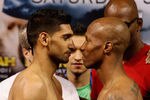 LAS VEGAS, NV - JULY 22:  Amir Khan (L) and Zab Judah during the weigh in to preview their Super Lightweight World Campionship Unification match at the Mandalay Bay Events Centre on July 22, 2011 in Las Vegas, Nevada.  (Photo by Scott Heavey/Getty Images)