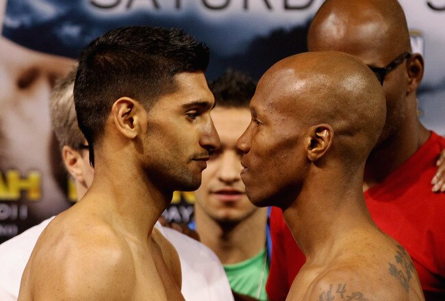LAS VEGAS, NV - JULY 22:  Amir Khan (L) and Zab Judah during the weigh in to preview their Super Lightweight World Campionship Unification match at the Mandalay Bay Events Centre on July 22, 2011 in Las Vegas, Nevada.  (Photo by Scott Heavey/Getty Images)