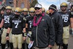 BOULDER, CO - NOVEMBER 13:  Interim head coach Brian Cabral prepares to lead Cody Hawkins #7 and the Colorado Buffaloes onto the field to face the Iowa State Cyclones at Folsom Field on November 13, 2010 in Boulder, Colorado. Cabral made his debut as interim head coach after head coach Dan Hawkins was fired this week as Colorado defeated Iowa State 34-14.  (Photo by Doug Pensinger/Getty Images)