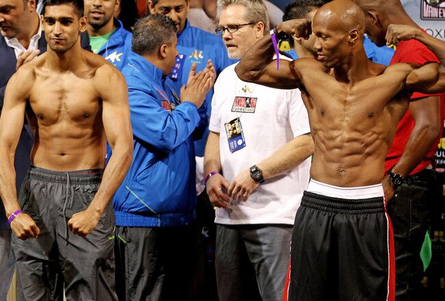 LAS VEGAS, NV - JULY 22:  Amir Khan (L) and Zab Judah during the weigh in to preview their Super Lightweight World Campionship Unification match at the Mandalay Bay Events Centre on July 22, 2011 in Las Vegas, Nevada.  (Photo by Scott Heavey/Getty Images)