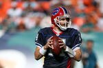 MIAMI - DECEMBER 19:  Quarterback Ryan Fitzpatrick #14 of the Buffalo Bills throws against the Miami Dolphins at Sun Life Stadium on December 19, 2010 in Miami, Florida.The Bills defeated the Dolphins 17-14.  (Photo by Marc Serota/Getty Images)