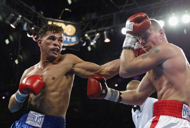 ATLANTIC CITY, NJ - NOVEMBER 23:  Arturo Gatti hits Mickey Ward with a left hook during their junior welterweight bout on November 23, 2002 at Convention Hall in Atlantic City, New Jersey.  (Photo by Al Bello/Getty Images)