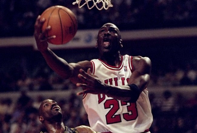 17 May 1998:  Michael Jordan #23 of the Chicago Bulls drives to the basket on Dale Davis #32 during the Bulls 85-79 NBA Playoff win at the United Center in Chicago, Illinois.   Mandatory Credit: Jonathan Daniel  /Allsport