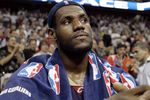 AUBURN HILLS, MI - MAY 21: LeBron James #23 of the Cleveland sits on the bench during the final seconds of game seven of the Eastern Conference Semifinals against the Detroit Pistons during the 2006 NBA Playoffs on May 21, 2006 at the Palace of Aubrun Hills in Auburn Hills, Michigan. The Pistons defeated the Cavs 79-61 to win their series 4-3.  NOTE TO USER: User expressly acknowledges and agrees that, by downloading and or using this photograph, User is consenting to the terms and conditions of the Getty Images License Agreement.  (Photo by Gregory Shamus/Getty Images)