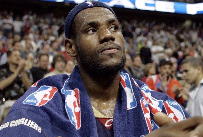 AUBURN HILLS, MI - MAY 21: LeBron James #23 of the Cleveland sits on the bench during the final seconds of game seven of the Eastern Conference Semifinals against the Detroit Pistons during the 2006 NBA Playoffs on May 21, 2006 at the Palace of Aubrun Hills in Auburn Hills, Michigan. The Pistons defeated the Cavs 79-61 to win their series 4-3.  NOTE TO USER: User expressly acknowledges and agrees that, by downloading and or using this photograph, User is consenting to the terms and conditions of the Getty Images License Agreement.  (Photo by Gregory Shamus/Getty Images)