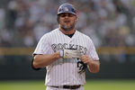 DENVER, CO - JUNE 29:  First baseman Jason Giambi #23 of the Colorado Rockies removes his batting gloves after grounding out against the Chicago White Sox during Interleague play at Coors Field on June 29, 2011 in Denver, Colorado. The White Sox defeated the Rockies 3-2.  (Photo by Doug Pensinger/Getty Images)
