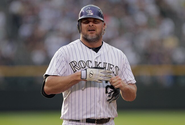 DENVER, CO - JUNE 29:  First baseman Jason Giambi #23 of the Colorado Rockies removes his batting gloves after grounding out against the Chicago White Sox during Interleague play at Coors Field on June 29, 2011 in Denver, Colorado. The White Sox defeated the Rockies 3-2.  (Photo by Doug Pensinger/Getty Images)