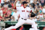BOSTON, MA - JULY 23: Josh Beckett #19 of the Boston Red Sox delivers a pitch in the first inning against the Seattle Mariners on July 23, 2011 at Fenway Park in Boston, Massachusetts.  (Photo by Elsa/Getty Images)