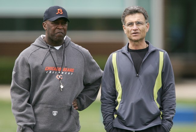 LAKE FOREST, IL - MAY 4: The head coach Lovie Smith (L) and general manager Jerry Angelo of the Chicago Bears look over players during a rookie mini-camp practice at Halas Hall May 4, 2007 in Lake Forest, Illinois. (Photo by Jonathan Daniel/Getty Images)