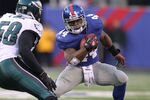 EAST RUTHERFORD, NJ - DECEMBER 19:  Ahmad Bradshaw #44 of the New York Giants runs with the ball as Trent Cole #58 of the Philadelphia Eagles defends during their game on December 19, 2010 at The New Meadowlands Stadium in East Rutherford, New Jersey.  (Photo by Al Bello/Getty Images)