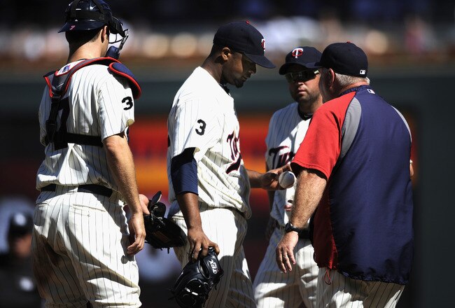 MINNEAPOLIS, MN - JULY 24: Francisco Liriano #47 of the Minnesota Twins gives the ball to manager Ron Gardenhire #35 of the Minnesota Twins in the third inning against the Detroit Tigers on July 24, 2011 at Target Field in Minneapolis, Minnesota. (Photo by Hannah Foslien/Getty Images)