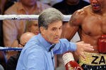 LAS VEGAS, NV - JULY 23:  (L-R) Referee Vic Drakulich seperates Zab Judah and Amir Khan after Judah closes his eye in the fifth round during their super lightweight world championship unification bout at Mandalay Bay Events Center on July 23, 2011 in Las Vegas, Nevada.  (Photo by Ethan Miller/Getty Images)
