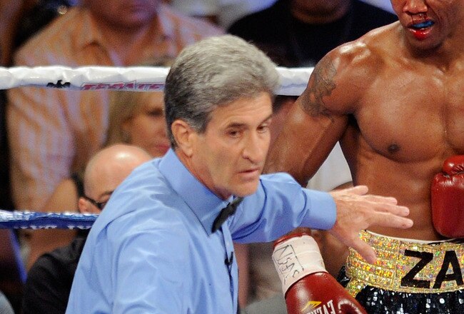 LAS VEGAS, NV - JULY 23:  (L-R) Referee Vic Drakulich seperates Zab Judah and Amir Khan after Judah closes his eye in the fifth round during their super lightweight world championship unification bout at Mandalay Bay Events Center on July 23, 2011 in Las Vegas, Nevada.  (Photo by Ethan Miller/Getty Images)