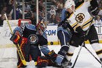SUNRISE, FL - DECEMBER 27: Goaltender Scott Clemmensen #30 of the Florida Panthers stops a shot taken by Byron Bitz #61 of the Boston Bruins on December 27, 2009 at the BankAtlantic Center in Sunrise, Florida. (Photo by Joel Auerbach/Getty Images)