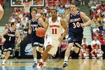 TUCSON, AZ - MARCH 17:  Jordan Taylor #11 of the Wisconsin Badgers drives down court in front of Trevor Noack #30 and Mick Hedgepeth #34 of the Belmont Bruins during the second round of the 2011 NCAA men's basketball tournament at McKale Center on March 17, 2011 in Tucson, Arizona.  (Photo by Harry How/Getty Images)