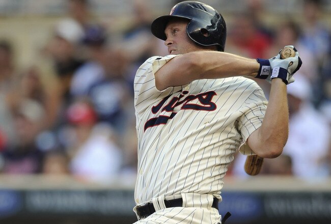 MINNEAPOLIS, MN - JULY 16: Michael Cuddyer #5 of the Minnesota Twins hits a single against the Kansas City Royals in the first inning on July 16, 2011 at Target Field in Minneapolis, Minnesota. The Twins defeated the Royals 4-3. (Photo by Hannah Foslien/Getty Images)