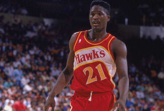 INGLEWOOD, CA - 1989:  Dominique Wilkins #21 of the Atlanta Hawks stands on the court during a NBA game against the Los Angeles Lakers at the Great Western Forum in Inglewood, California in 1989.  (Photo by Ken Levine/Getty Images)