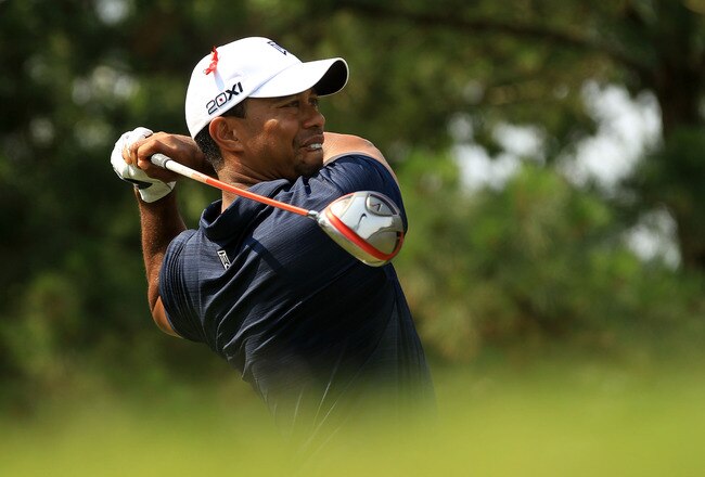 PONTE VEDRA BEACH, FL - MAY 12:  Tiger Woods hits his tee shot on the ninth hole during the first round of THE PLAYERS Championship held at THE PLAYERS Stadium course at TPC Sawgrass on May 12, 2011 in Ponte Vedra Beach, Florida.  (Photo by Streeter Lecka/Getty Images)