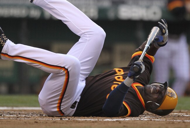 SEATTLE - JULY 01:  Orlando Hudson #1 of the San Diego Padres falls to the ground in pain after being injured on a swing against the Seattle Mariners at Safeco Field on July 1, 2011 in Seattle, Washington. Hudson was removed from the game. (Photo by Otto Greule Jr/Getty Images)