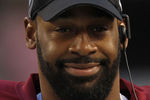 ARLINGTON, TX - DECEMBER 19:  Quarterback Donovan McNabb #5  of the Washington Redskins on the sidelines against play against the Dallas Cowboys at Cowboys Stadium on December 19, 2010 in Arlington, Texas.  (Photo by Ronald Martinez/Getty Images)