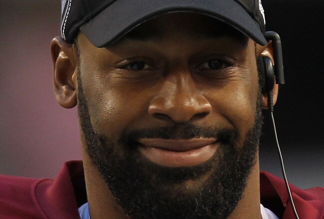 ARLINGTON, TX - DECEMBER 19:  Quarterback Donovan McNabb #5  of the Washington Redskins on the sidelines against play against the Dallas Cowboys at Cowboys Stadium on December 19, 2010 in Arlington, Texas.  (Photo by Ronald Martinez/Getty Images)