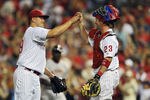 PHILADELPHIA, PA - JULY 26: Starting pitcher Vance Worley #49 of the Philadelphia Phillies high-fives teammate Brian Schneider #23 after pitching a complete game and defeating the San Francisco Giants 7-2 at Citizens Bank Park on July 26, 2011 in Philadelphia, Pennsylvania. (Photo by Drew Hallowell/Getty Images)