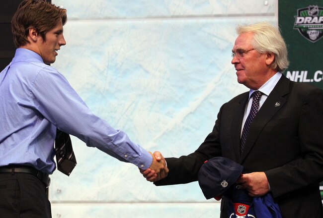 ST PAUL, MN - JUNE 24:  Fifteenth overall pick Jonathan Miller by the New York Rangers shakes hands with General Manager Glen Sather of the New York Rangers during day one of the 2011 NHL Entry Draft at Xcel Energy Center on June 24, 2011 in St Paul, Minnesota.  (Photo by Bruce Bennett/Getty Images)