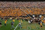 BOULDER, CO - SEPTEMBER 29:  The goal posts are lowered as the fans swarm the field after place kicker Kevin Eberhart of the Colorado Buffaloes kicked the game winning field goal as time expires against the Oklahoma Sooners at Folsom Field on September 29, 2007 in Boulder, Colorado. Colorado defeated Oklahoma 27-24.  (Photo by Doug Pensinger/Getty Images)