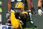 GREEN BAY, WI - SEPTEMBER 19: Nick Barnett #56 of the Green Bay Packers celebrates a defensive stop against Marshawn Lynch #23 of the Buffalo Bills at Lambeau Field on September 19, 2010 in Green Bay, Wisconsin. The Packers defeated the Bills 34-7. (Photo by Jonathan Daniel/Getty Images)