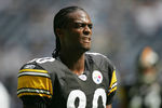 IRVING, TX - OCTOBER 17:  Wide reciever Plaxico Burress #80 of the Pittsburgh Steelers watches during the game with the Dallas Cowboys at Texas Stadium on October 17, 2004 in Irving, Texas. The Steelers defeated the Cowboys 24-20.  (Photo by Harry How/Getty Images)