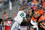 DENVER - OCTOBER 17:  Wide receiver Jabar Gaffney #10 of the Denver Broncos hauls in a reception against cornerback Darrelle Revis #24 of the New York Jets at INVESCO Field at Mile High on October 17, 2010 in Denver, Colorado.  (Photo by Justin Edmonds/Getty Images)