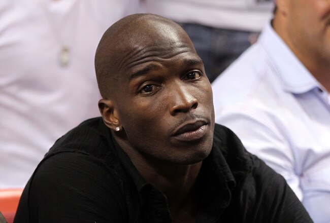 MIAMI, FL - MAY 24:  Chad 'Ochocinco' Johnson watches the Miami Heat play against the Chicago Bulls in Game Four of the Eastern Conference Finals during the 2011 NBA Playoffs on May 24, 2011 at American Airlines Arena in Miami, Florida. NOTE TO USER: User expressly acknowledges and agrees that, by downloading and or using this photograph, User is consenting to the terms and conditions of the Getty Images License Agreement.  (Photo by Mike Ehrmann/Getty Images)