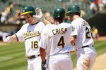 OAKLAND, CA - MAY 29:  Josh Willingham #16 of the Oakland Athletics is congratulated by Coco Crisp #4 and Conor Jackson #28 after he hit a home run to score them allin the fifth inning against the Baltimore Orioles at Oakland-Alameda County Coliseum on May 29, 2011 in Oakland, California.  (Photo by Ezra Shaw/Getty Images)