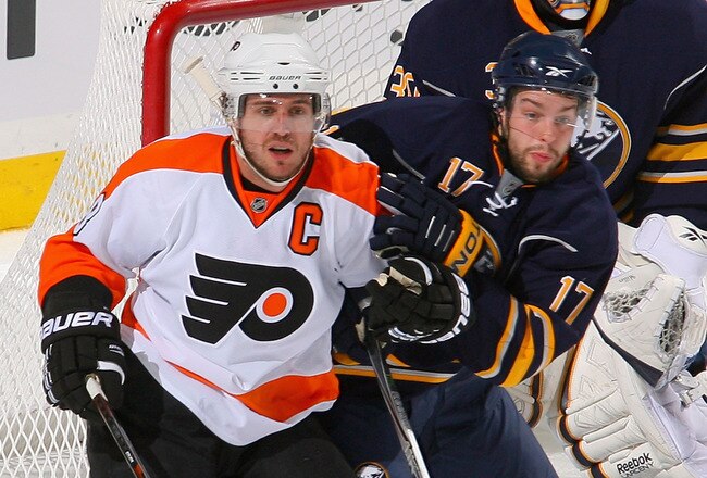 BUFFALO, NY - APRIL 24: Marc-Andre Gragnani #17  and Ryan Miller #30 of the Buffalo Sabres defend against Mike Richards #18 of the Philadelphia Flyers in Game Six of the Eastern Conference Quarterfinals during the 2011 NHL Stanley Cup Playoffs at HSBC Arena at HSBC Arena on April 24, 2011 in Buffalo, New York.  (Photo by Rick Stewart/Getty Images)