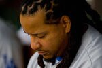 ST. LOUIS - JULY 18: Manny Ramirez #99 of the Los Angeles Dodgers sits in the dugout against the St. Louis Cardinals at Busch Stadium on July 18, 2010 in St. Louis, Missouri.  (Photo by Dilip Vishwanat/Getty Images)