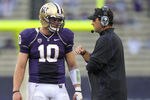 SEATTLE - SEPTEMBER 11:  Head coach Steve Sarkisian of the Washington Huskies talks with quarterback Jake Locker #10 during the game against the Syracuse Orange on September 11, 2010 at Husky Stadium in Seattle, Washington. (Photo by Otto Greule Jr/Getty Images)