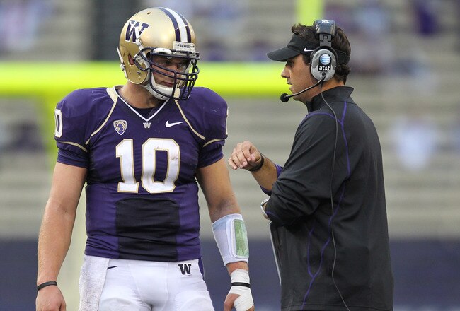 SEATTLE - SEPTEMBER 11:  Head coach Steve Sarkisian of the Washington Huskies talks with quarterback Jake Locker #10 during the game against the Syracuse Orange on September 11, 2010 at Husky Stadium in Seattle, Washington. (Photo by Otto Greule Jr/Getty Images)