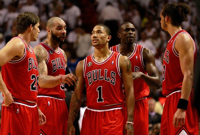 MIAMI, FL - MAY 24:  (L-R) Kyle Korver #26, Carlos Boozer #5, Derrick Rose #1, Luol Deng #9 and Joakim Noah #13 of the Chicago Bulls talk on court against the Miami Heat in Game Four of the Eastern Conference Finals during the 2011 NBA Playoffs on May 24, 2011 at American Airlines Arena in Miami, Florida. The Heat won 101-93 in overtime. NOTE TO USER: User expressly acknowledges and agrees that, by downloading and or using this photograph, User is consenting to the terms and conditions of the Getty Images License Agreement.  (Photo by Marc Serota/Getty Images)