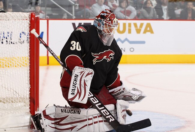 GLENDALE, AZ - MARCH 29:  Goaltender Ilya Bryzgalov #30 of the Phoenix Coyotes makes a pad save on the shot from the Dallas Stars during the third period of the NHL game at Jobing.com Arena on March 29, 2011 in Glendale, Arizona.   The Coyotes defeated the Stars 2-1 in an overtime shoot out. (Photo by Christian Petersen/Getty Images)