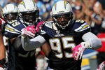 SAN DIEGO - OCTOBER 3: Linebackers Shaun Phillips #95 and Kevin Burnett #99 of the San Diego Chargers celebrate a Phillips sack against the Arizona Cardinals at Qualcomm Stadium on October 3, 2010 in San Diego, California.   The Chargers won 41-10.  (Photo by Stephen Dunn/Getty Images)