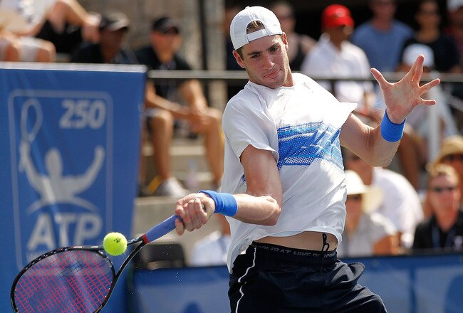 NORCROSS, GA - JULY 24:  John Isner plays a forehand during the singles final against Mardy Fish at the Atlanta Tennis Championships at the Racquet Club of the South on July 24, 2011 in Norcross, Georgia.  (Photo by Mike Ehrmann/Getty Images)