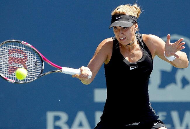 STANFORD, CA - JULY 29:  Sabine Lisicki of Germany returns a shot to Agnieszka Radwanska of Poland during the Bank of the West Classic at the Taube Family Tennis Stadium on July 29, 2011 in Stanford, California.  (Photo by Matthew Stockman/Getty Images)