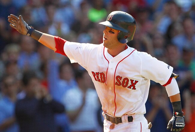 BOSTON, MA  - JULY 28:  Dustin Pedroia #15 of the Boston Red Sox celebrates after he connected for a home run in the eighth inning against the Kansas City Royals at Fenway Park on July 28, 2011 in Boston, Massachusetts.  (Photo by Jim Rogash/Getty Images)