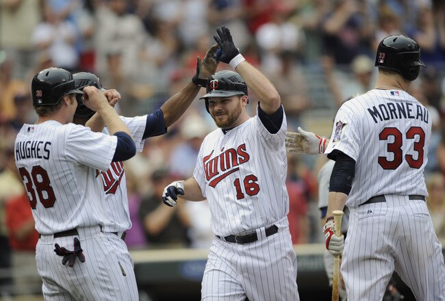 MINNEAPOLIS, MN - MAY 11: Luke Hughes #38, Denard Span #2, Jason Kubel #16 and Justin Morneau #33 of the Minnesota Twins celebrate a three-run home run by Kubel off Daniel Schlereth #55 of the Detroit Tigers during in the seventh inning of their game on May 11, 2011 at Target Field in Minneapolis, Minnesota. Tigers defeated the Twins 9-7. (Photo by Hannah Foslien/Getty Images)