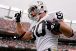 DENVER - OCTOBER 24:  Tight end Zach Miller #80 of the Oakland Raiders celebrates a touchdown reception in the first quarter against the Denver Broncos at INVESCO Field at Mile High on October 24, 2010 in Denver, Colorado. (Photo by Justin Edmonds/Getty Images)