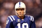 INDIANAPOLIS, IN - JANUARY 08:  Quarterback Peyton Manning #18 of the Indianapolis Colts looks on during warm ups against the New York Jets during their 2011 AFC wild card playoff game at Lucas Oil Stadium on January 8, 2011 in Indianapolis, Indiana.  (Photo by Andy Lyons/Getty Images)